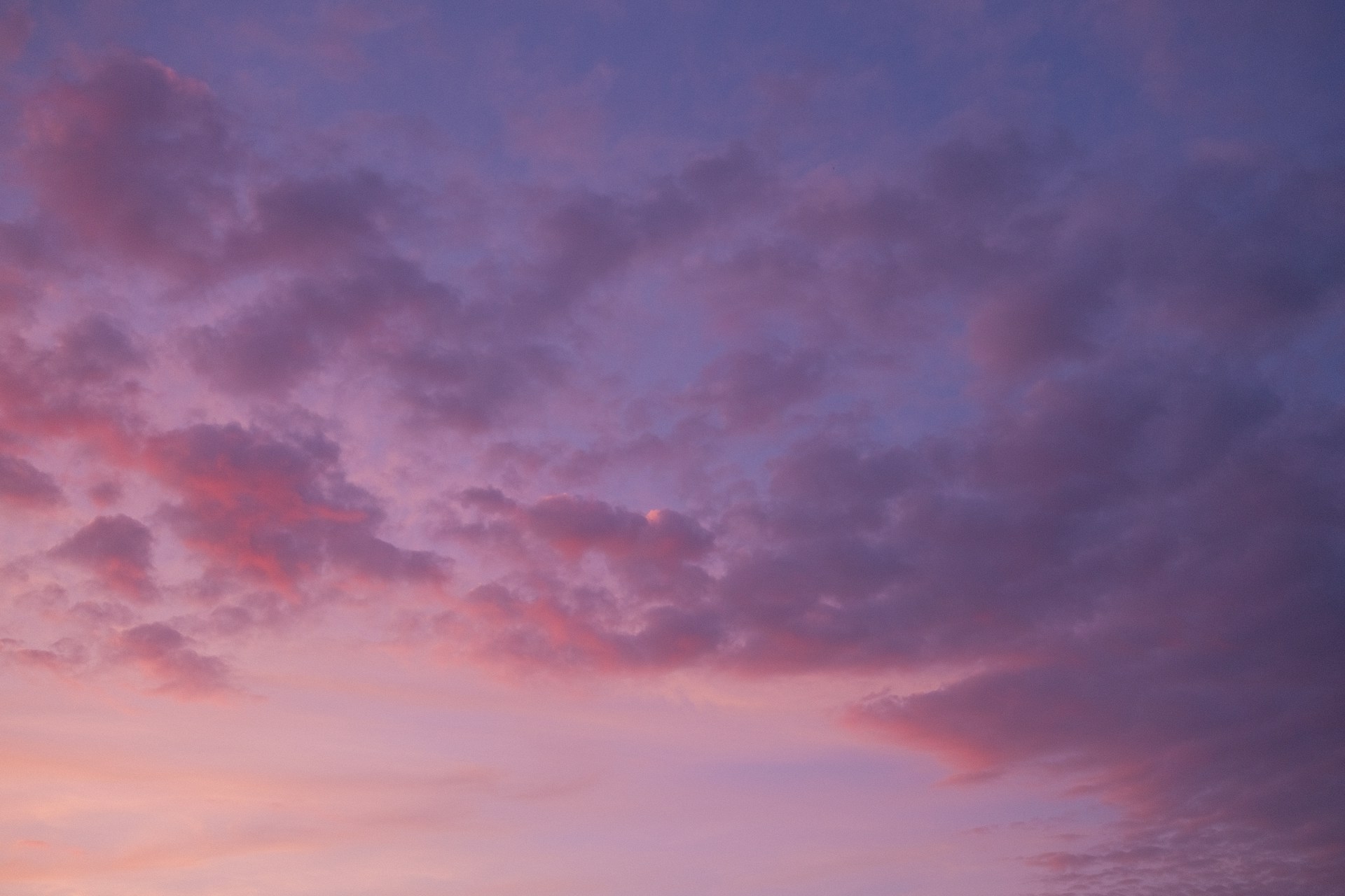 Decorative cloud graphic with a soft, luminous sky.