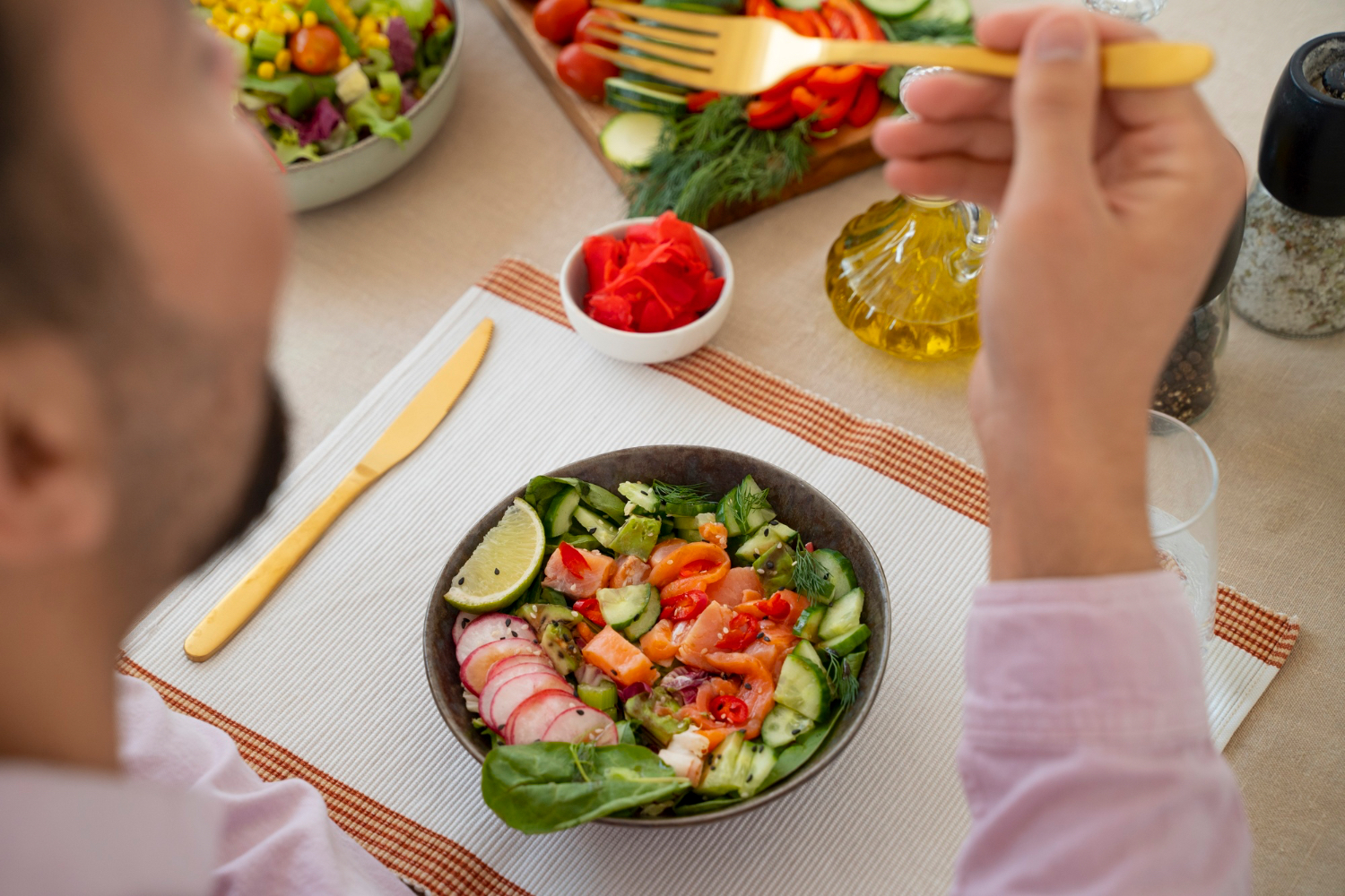 A salmon and vegetable bowl with little starchy carbohydrate on the plate.